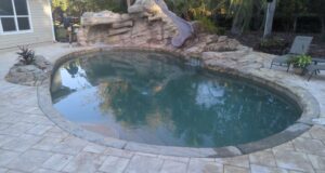Leaking Gunite Swimming Pool with Grotto, Water Slide and Waterfall
