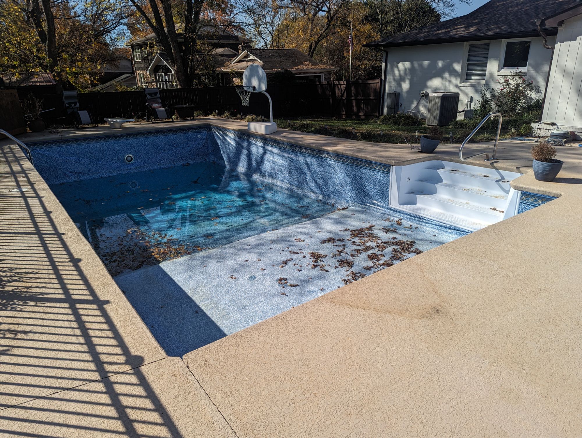 Leaking vinyl liner swimming pool with no water in shallow end