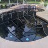 Pebble Tech Finish Gunite Pool and Spa Combo with Water Loss at Spa Glass Wall Transition in Keystone Heights, Florida